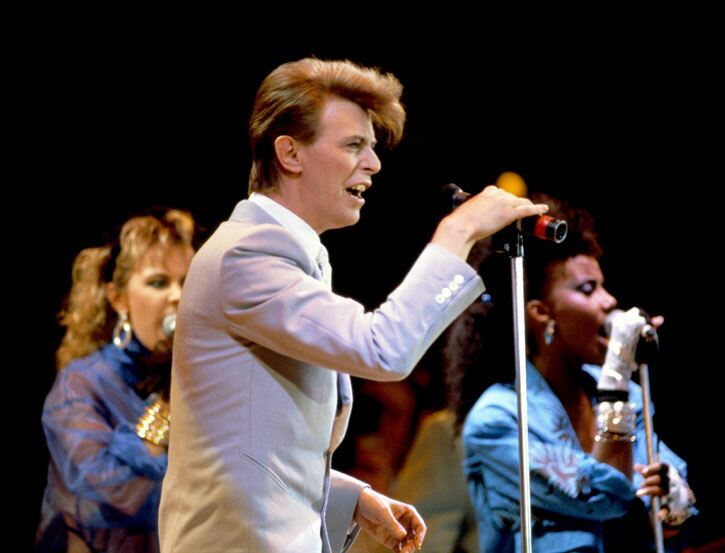 David Bowie in one of his trademark pastel suits by in 1985. PA Archive. David Bowie in one of his trademark pastel suits by in 1985. PA Archive.