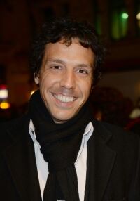 Alex Gaumond slips on a scarf
