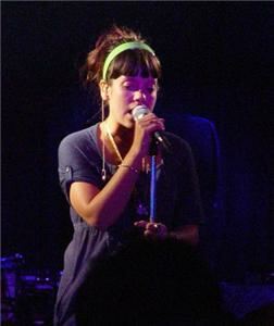 Lily Allen slips a sight of stockings