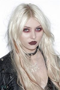 Taylor Momsen wears ripped tights for gothic effect