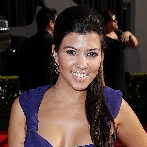 Kourtney Kardashian wears black tights to store opening
