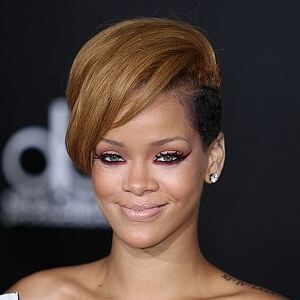 Rihanna wears tights but forgets skirt for surprise Times Square show