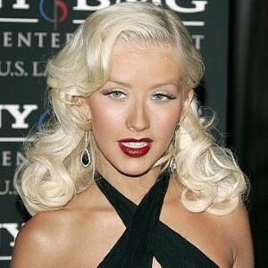 Christina Aguilera and Isla Fisher match in red dress, black tights