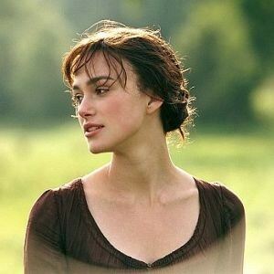 Kiera Knightley works the vintage look with tights and brogues