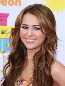 Miley Cyrus shows off rock chick look with tights