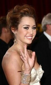 Miley Cyrus all grown up in stockings and suspenders