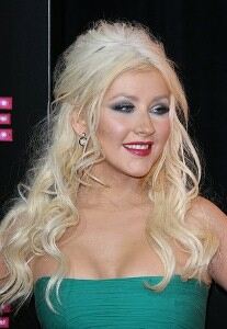 Christina Aguilera pairs hotpants with shiny tights