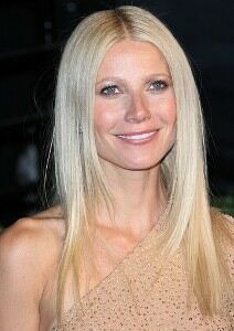 Gwyneth Paltrow poses topless in fishnet tights