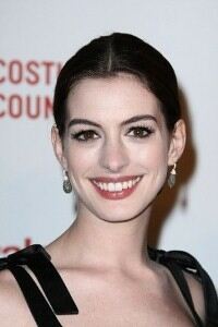 Anne Hathaway goes designer in black tights