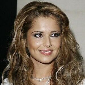 Cheryl Cole jets back to London in leopard print leggings