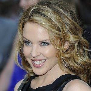 Kylie Minogue teases in fishnet tights