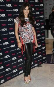 Cheryl Cole promotes album in leather leggings