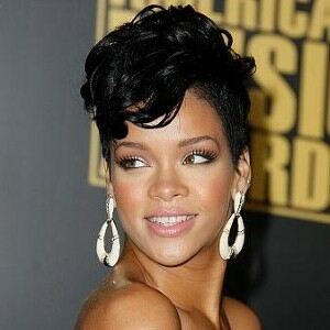 Rihanna bares her legs in fishnet tights