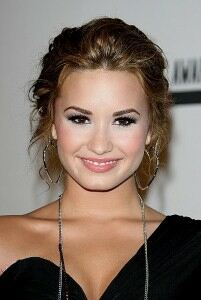 Demi Lovato wears ripped tights for edgy look