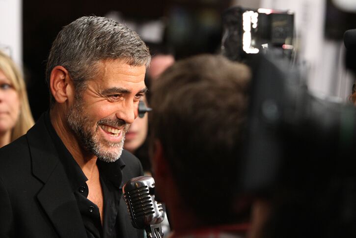 George Clooney is happy to spread the sock wealth