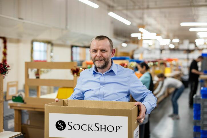 Warehouse Manager Pete gathering socks to add to our donation