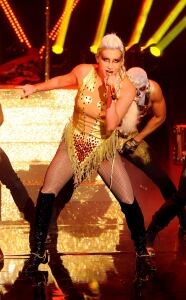 Ke$ha takes to stage in fishnets