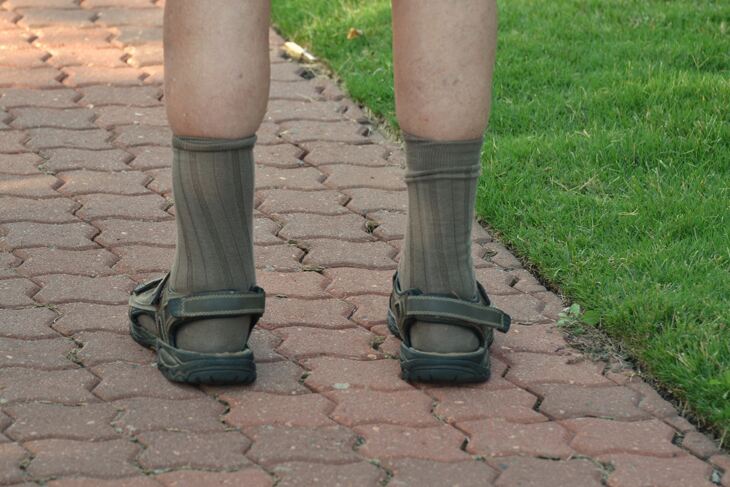 Man wearing socks and sandals